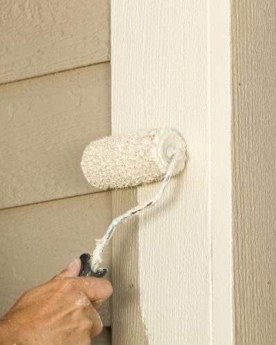 House Painter Rolling Siding Trim Board